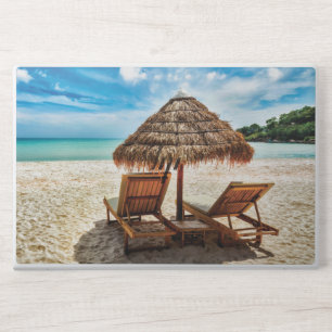 Lounge chairs on beach throw pillow HP laptop skin
