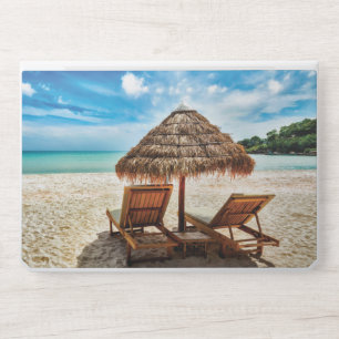 Lounge chairs on beach throw pillow HP laptop skin