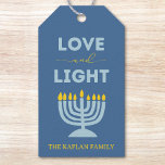 "Love and Light" Menorah Personalized Hanukkah Gift Tags<br><div class="desc">Add a meaningful touch to your Hanukkah gifts with these elegant "Love and Light" gift tags! Featuring a soothing blue background, a bright menorah illustration, and the uplifting message "Love and Light, " these tags are perfect for holiday presents, party favors, or festive decor. Customizable with your family name, they...</div>