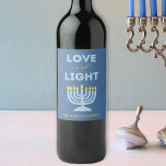 "Love and Light" Menorah Personalized Hanukkah Wine Label<br><div class="desc">Bring warmth and elegance to your Hanukkah table with these "Love and Light" wine labels! Featuring a serene blue background, a vibrant menorah illustration, and the heartfelt message "Love and Light, " these labels are perfect for adding a festive touch to your holiday gatherings. Customizable with your family name, they...</div>