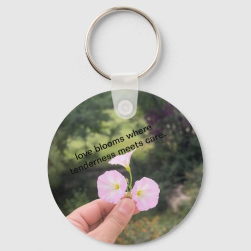love blooms where tenderness meets care keychain