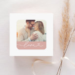 Love Heart Script Custom Muted Pink Wedding Photo Square Sticker<br><div class="desc">Custom wedding envelope seal / favor stickers feature a favorite photo with minimal white "Love" typography overlay design that includes flourish and heart details. Note,  the muted "rose tan" pink colored background and white text can be customized. A sweet personalized accent for wedding stationery and favors.</div>