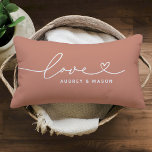 Love in Heart Script Muted Clay Custom Monogram Lumbar Pillow<br><div class="desc">Modern and stylish custom lumbar throw pillow design features a simple and minimal "Love" typography design that includes flourish and heart details. Personalize the uppercase text below with a monogram for a couple or family, a quote, or other preferred text. The muted clay orange and white colors can be modified....</div>