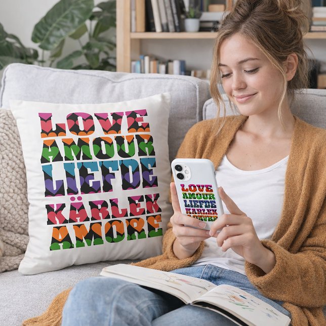 Love in Multilanguages Neon Hearts Throw Pillow (A throw pillow that says love in multiple languages with a heart pattern.)