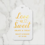Love is Sweet Modern Heart Script Wedding Gold Foil Gift Tags<br><div class="desc">Elegant custom wedding favor tags feature real gold foil typography on the front with modern heart calligraphy script "Love is Sweet" design, along with a stylish minimal monogram of the bride and groom first names, wedding date, and "enjoy a treat" message that can be personalized. The back of the tag...</div>