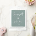 Love Is Sweet Personalized Wedding Favor Hot Chocolate Drink Mix<br><div class="desc">A perfect party favor for your rehearsal dinner,  engagement party,  or wedding,  drink mix packets feature white handwritten lettering on a dusty sage green background with a small heart illustration in the center. "Love Is Sweet" appears at the top,  with your event name and date beneath.</div>