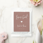 Love Is Sweet Personalized Wedding Favor Hot Chocolate Drink Mix<br><div class="desc">A perfect party favor for your rehearsal dinner,  engagement party,  or wedding,  drink mix packets feature white handwritten lettering on an earth tone terracotta background with a small heart illustration in the center. "Love Is Sweet" appears at the top,  with your event name and date beneath.</div>
