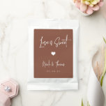 Love Is Sweet Personalized Wedding Favor Hot Chocolate Drink Mix<br><div class="desc">A perfect party favor for your rehearsal dinner,  engagement party,  or wedding,  drink mix packets feature white handwritten lettering on an earth tone terracotta rust background with a small heart illustration in the center. "Love Is Sweet" appears at the top,  with your event name and date beneath.</div>