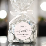 Love Is Sweet Pink Wedding Favor Classic Round Sticker<br><div class="desc">Chic light pink sticker for your wedding reception favors featuring "Love Is Sweet" in simple modern typography and an elegant calligraphy script with swashes,  your first names joined together by a heart and your wedding date.</div>