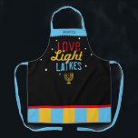 Love Light Latkes Black Hanukkah Funny Quote Apron<br><div class="desc">Love Light Latkes Black Hanukkah Funny Quote Apron is totally hipster cool! This colorful, humorous saying really stands out on the black starry-night background. Sure to make friends & Family smile. Includes a menorah icon and space for your name. Need help with this design? Want to see other colors or...</div>