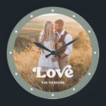 Love | Modern Script with Photo Sage Green Large Clock<br><div class="desc">This colorful and stylish clock features your favorite personal family photo,  with trendy white typography and a spot to add your name. The border of the clock is a sage green color.</div>