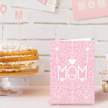 Love Mom Simple Elegant White Lace Mother's Day Card<br><div class="desc">This elegant and simple Mother's Day card is the perfect design for your mother on her special day. It features white hand-drawn flowers and hearts lace intertwined with the word, "Mom, " and the personalized message, "I love you, " on top of a medium pink background. It's sweet, cute, artsy,...</div>