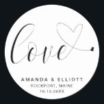 Love Romantic Black and White Typography Wedding Classic Round Sticker<br><div class="desc">Typography favor stickers featuring the word, "love" in black calligraphy with a heart swash at the end, over a white background. Below are your names, location and date of your wedding. The simple and minimal layout and lots of open space give this design a modern feel and the calligraphy lettering...</div>