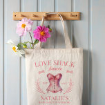 Love Shack Fiancee Coquette Girly Bow Bachelorette Tote Bag<br><div class="desc">Our Love Shack Fiancee Coquette Girly Bow Bachelorette Tote Bag, the perfect accessory for an unforgettable celebration with a vintage-style coquette cocktail club theme. This tote bag embodies the essence of a coquette aesthetic bachelorette party, complete with classy bow details and a touch of romance. Whether you're gathering at the...</div>