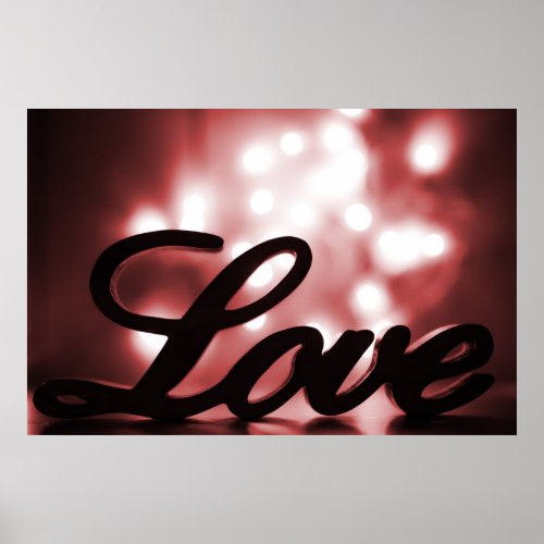 Love sign with red sparkle lights behind
