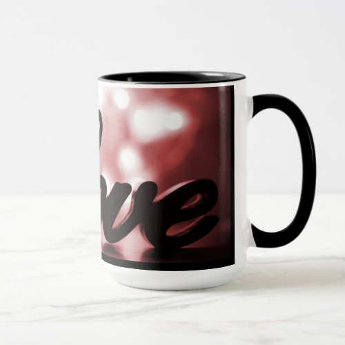 Love sign with red sparkle lights behind mug