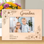 Love you Grandma Floral Personalized Wood Picture Engraved Frames<br><div class="desc">Cherish Every Moment with Grandma Introducing the Personalized Etched Wood Frame, a beautiful way to celebrate the special bond between grandchildren and their beloved grandma. This exquisite wooden picture frame is adorned with delicate floral designs etched into each corner, creating a charming and timeless aesthetic that complements any photo. Features...</div>