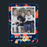 Love You Grandma Floral Photo Personalized Magnet<br><div class="desc">Say "We love you grandma" with this photo magnet framed in a vibrant floral pattern. Text is in a modern script font and customizable. Part of a collection from Parcel Studios.</div>