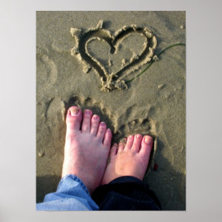 Lovebirds make heart in sand by ocean in poster