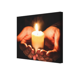 Loving Hands holding a Candle with Flame Canvas Print