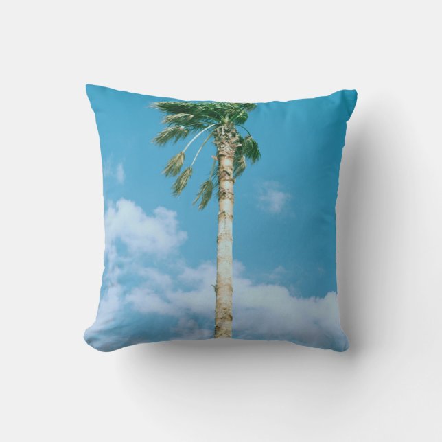 Low-angle photo of palm trees under blue sky throw pillow (Front)