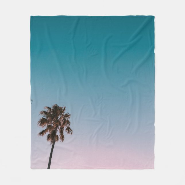 Low-angle photograph of three palm trees under blu fleece blanket (Front)