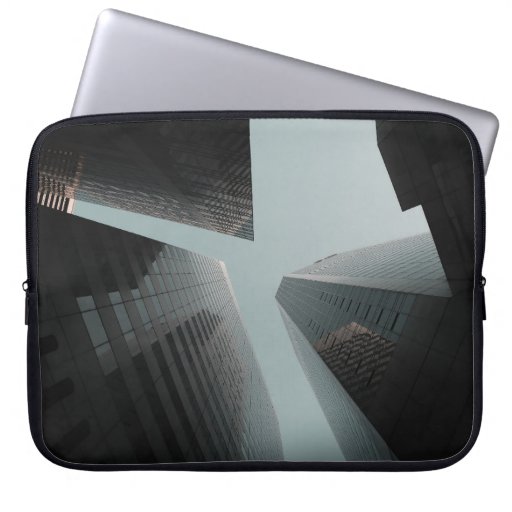 LOW ANGLE PHOTOGRAPHY OF BUILDINGS AT DAYTIME LAPTOP SLEEVE