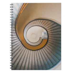 Low angle photography of spiral ladder notebook