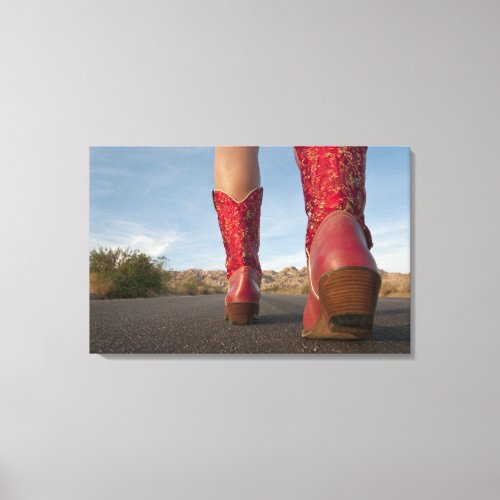 Low_angle view of woman wearing cowboy boots canvas print