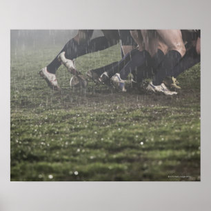 Lower section of rugby player in scrum, pushing poster