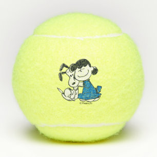 Lucy Hugging Snoopy Tennis Balls