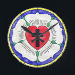 Luther Rose Stained Glass Round Wall Clock<br><div class="desc">The Luther Rose's symbolism dates back to the 1520s. Luther explained that the red heart with the black cross represents the righteous living by faith in Christ the Crucified. The heart rests on a white rose, symbolizing joy, comfort, and peace found through faith. The choice of white reflects the color...</div>