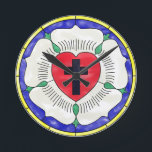 Luther Rose Stained Glass Round Wall Clock<br><div class="desc">The Luther Rose's symbolism dates back to the 1520s. Luther explained that the red heart with the black cross represents the righteous living by faith in Christ the Crucified. The heart rests on a white rose, symbolizing joy, comfort, and peace found through faith. The choice of white reflects the color...</div>