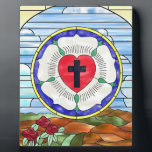 Luther Rose Stained Glass Window Plaque<br><div class="desc">The Luther Rose's symbolism dates back to the 1520s. Luther explained that the red heart with the black cross represents the righteous living by faith in Christ the Crucified. The heart rests on a white rose, symbolizing joy, comfort, and peace found through faith. The choice of white reflects the color...</div>