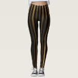Luxurious Black and Gold Stripes Leggings<br><div class="desc">Make a statement with these luxurious black and gold stripes leggings. The elegant design features bold gold stripes on a rich black background, adding a touch of glamour and sophistication to your wardrobe. Perfect for dressing up a casual outfit or for a night out on the town, these stylish leggings...</div>