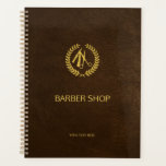 Luxury barber shop brown leather look gold planner<br><div class="desc">Barber shop planner with faux gold scissors and laurel wreath logo and barber script on a solid dark brown elegant leather look background.                Perfect as an appointment book</div>
