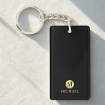 Luxury Black and Gold Personalized Monogram Keychain<br><div class="desc">Luxury Black and Gold Design featuring black monogram in gold circle element with name in gold professional font style on black background. Perfect as father's day gifts for dad, gifts for grandfather, husband, groomsman and more. Please Note : The foil details are simulated in the artwork. No actual foil will...</div>