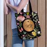 Luxury black and pastel pink floral monogram tote bag<br><div class="desc">Glam girly chic tote bag featuring a chic pastel wildflower meadow pattern and a copper brass gold round label and a little heart over moody black background.          Personalize it with your monogram name initials!</div>