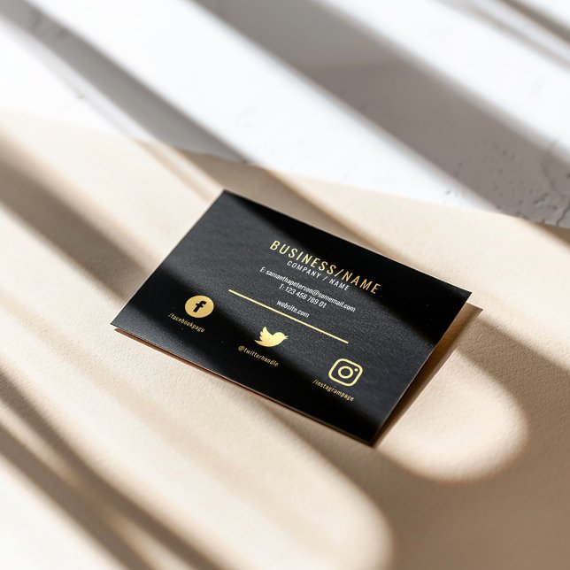 Luxury bold black and gold social media icons business card (Black business card with gold text, minimalist layout, and social media icons.)