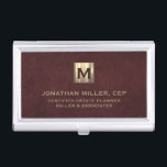 Luxury Gold Initial Logo Oxblood Leather Business Card Case<br><div class="desc">Simple modern luxury design with brushed metallic gold initial logo medallion with personalized name,  title,  company name or custom text below in classic block typography on a oxblood red leather textured background. Personalize for your custom use.</div>