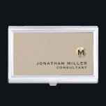 Luxury Gold Monogram Beige Business Card Case<br><div class="desc">Simple modern design with luxury brushed metallic gold monogram medallion with personalized name and title or custom text below in classic block typography on a solid beige background. Personalize for your custom use.</div>