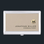 Luxury Gold Monogram Beige Business Card Case<br><div class="desc">Simple modern design with luxury brushed metallic gold monogram medallion with personalized name and title or custom text below in classic block typography on a solid beige background. Personalize for your custom use.</div>