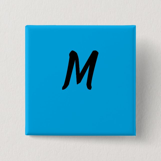 M on a Blue Button (Front)
