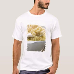 Macaroni cheese in baking dish with wooden T-Shirt