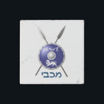 Maccabee Shield And Spears Stone Magnet<br><div class="desc">A depiction of a Maccabee's shield and two spears. The shield is adorned by a lion and text reading "Yisrael" (Israel) in the Paleo-Hebrew alphabet. "Maccabee" also appears in modern Hebrew. The Maccabees were Jewish rebels who freed Judea from the yoke of the Seleucid Empire. Chanukkah is not just a...</div>