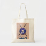 Maccabee Shield And Spears Tote Bag<br><div class="desc">A depiction of a Maccabee's shield and two spears hanging on a wall. Battle worn and rusty, but still serviceable. The shield is adorned by a lion and text reading "Yisrael" (Israel) in the Paleo-Hebrew alphabet. "Maccabee" also appears in modern Hebrew. The Maccabees were Jewish rebels who freed Judea from...</div>