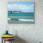 Mackinac Bridge in Summer Canvas Print<br><div class="desc">Peaceful blue sky afternoon in Up North Michigan with a view of the Mackinac Bridge spanning the peninsulas while a dark freighter pushes underneath. You can change the size of this to a quite big choice, just make sure you adjust the image as necessary so blank canvas doesn't show on...</div>