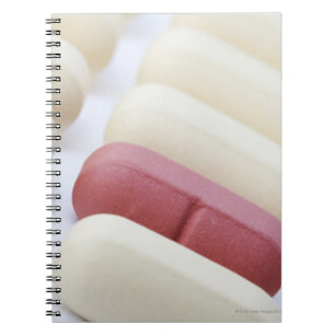 Macro/Close-up of multivitamins on a white Notebook