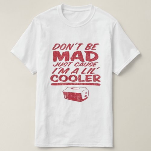 The "Don't be mad just cause I'm a lil cooler" T-shirt. Crafted for the cool, the dope, and the hip hop heads, this tee is the epitome of urban streetwear fashion. In bold red font, the message "Don't be mad just cuz I'm a lil cooler" makes a bold statement, letting the world know that you're unapologetically fresh. Above it, a small drink cooler graphic adds a playful touch, embodying the laid-back attitude of those who rock this tee. Designed for both men and women who embrace the urban lifestyle, our white tee is a versatile addition to any wardrobe. Whether you're hitting up the block party or chilling with your crew, this tee ensures you stand out with style. But it's not just about making a statement – we're all about quality too. Our tees are meticulously crafted using premium materials that rival those of other top brands in the game. Expect nothing less than superior comfort, durability, and fit when you slip into one of our shirts. Infused with the essence of hip hop culture, our tee pays homage to the music that shapes our lives. It's a nod to the beats, the rhymes, and the swagger that define the streets. And the best part? Looking fresh doesn't have to break the bank. Our tees offer unbeatable quality at an affordable price, so you can stunt without emptying your wallet. So, if you're ready to level up your streetwear game, don't sleep on the "Don't be mad just cuz I'm a lil cooler" tee. Get yours today and let your style speak volumes. Because when it comes to fashion, being cool isn't just an option – it's a way of life.