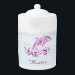 Magenta Dolphin Personalized Teapot<br><div class="desc">Enjoy your tea with a Magenta Dolphin Personalized Teapot.  Teapot design features a vibrant metallic dolphin against a muted seascape adorned elegant scrolls with an area to personalize with your name.  Additional gift items available with this design as well as a variety of colors.</div>